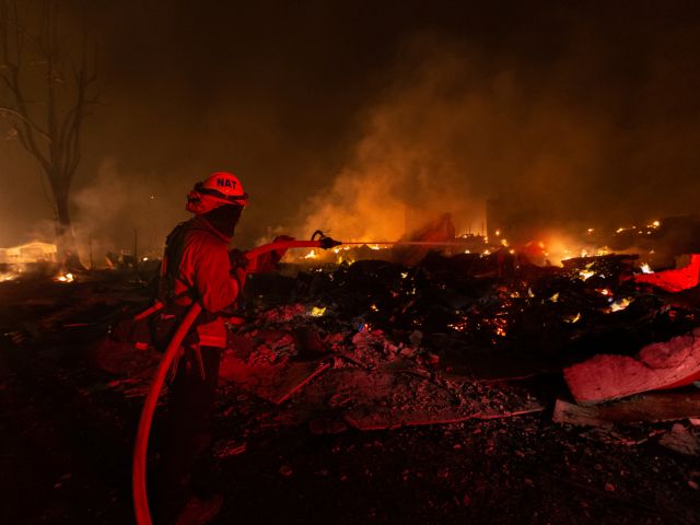 Firefighter in Greenville, Calif. battling the 2021 Dixie Fire